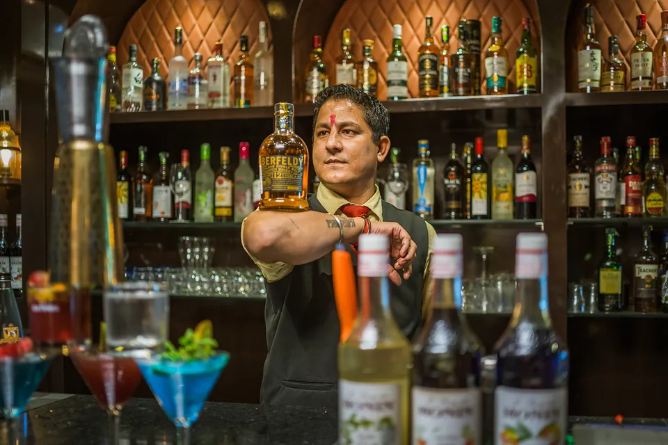 Bartender preparing signature cocktails at Jigyasa Palace bar