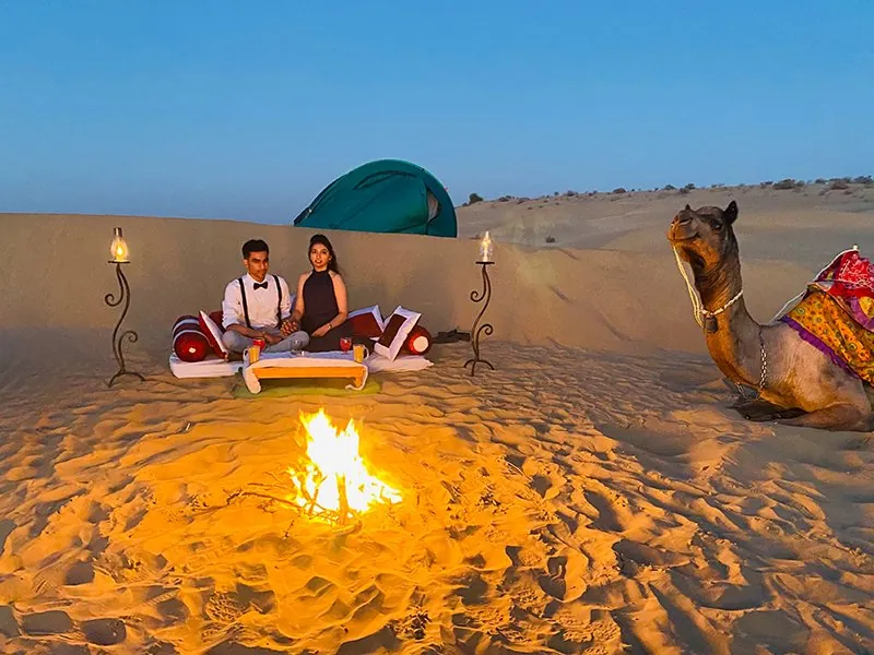 Candlelight dinner on the desert dunes