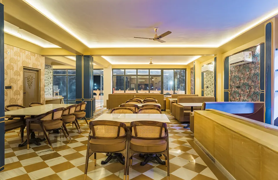 Indoor dining hall of the Jigyasa Palace restaurant with checkered floor