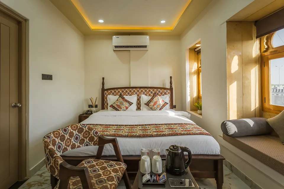 Signature Room with king bed, jharokha window seat and tea tray