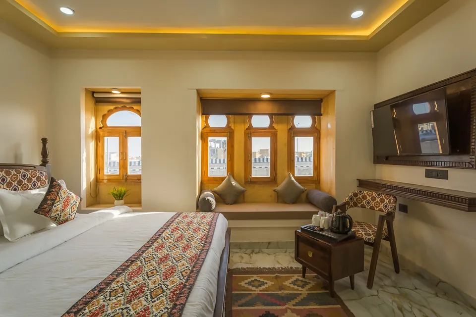 Signature Room with jharokha windows, smart TV and Rajasthani textiles